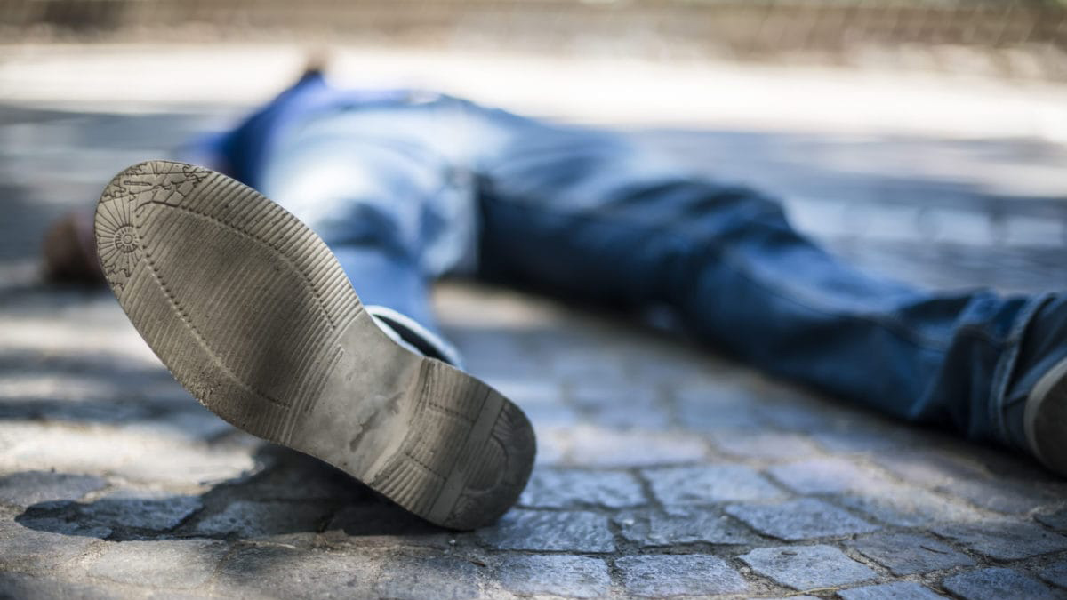 Image of a Person Lying on the Pavement