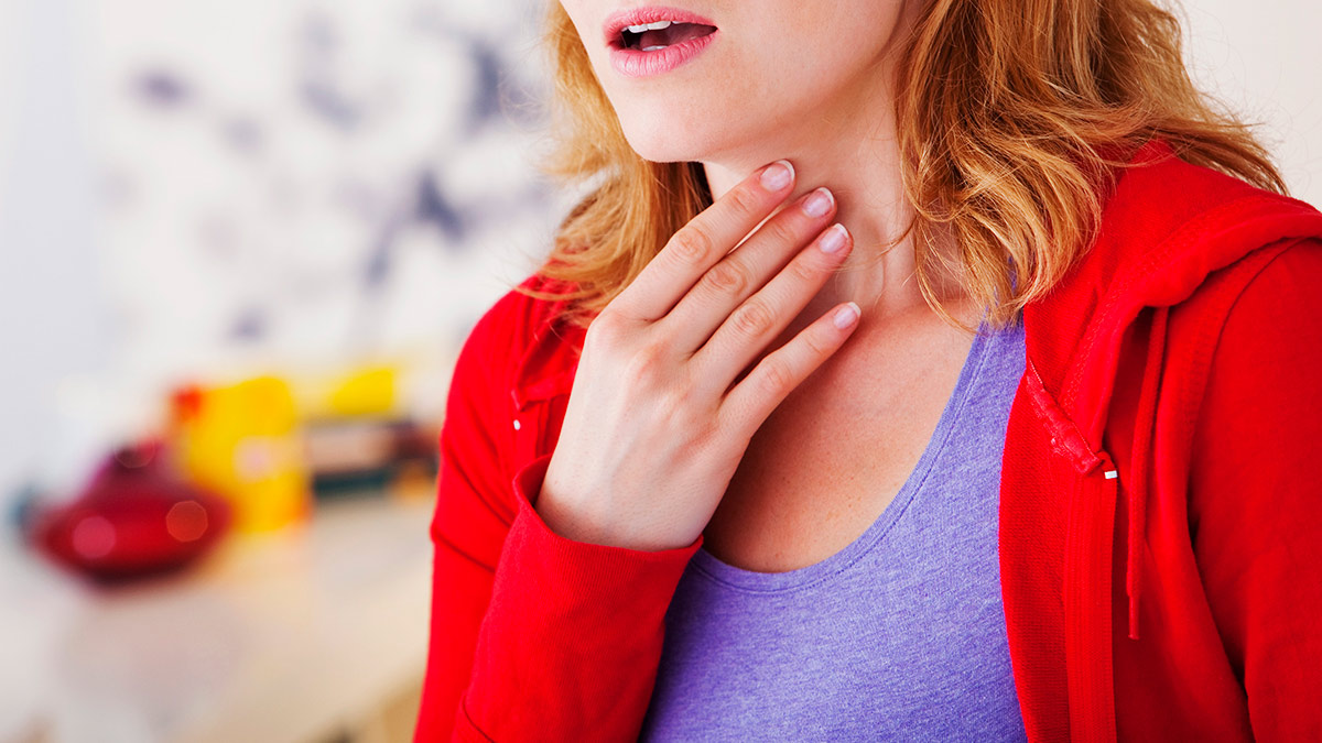 Image of a Woman Holding Her Neck