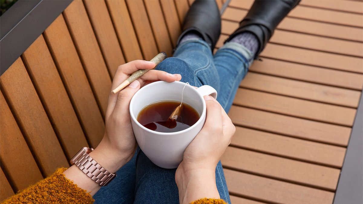 Image of Person Holding a Tea and Joint