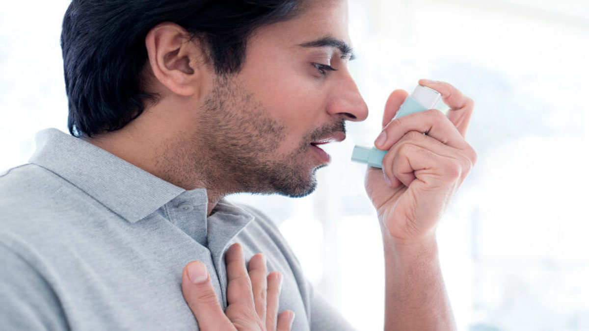 Man with asthma relieved by inhaler
