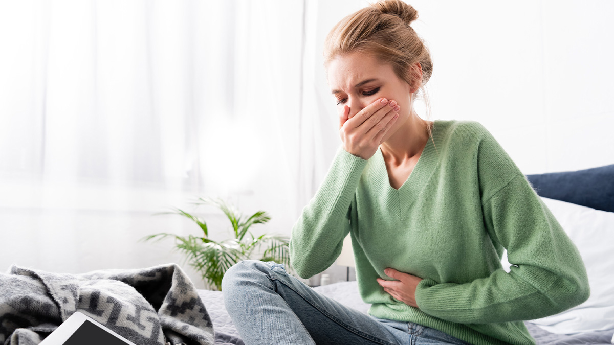 A woman at home with nausea use weed to help