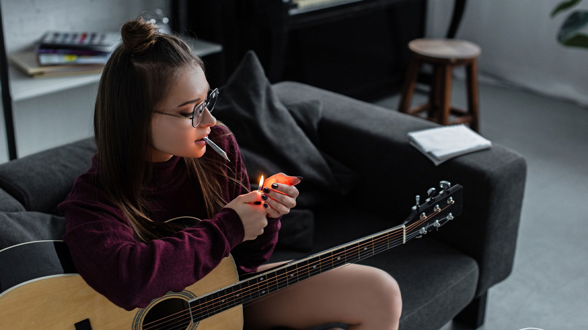 Woman smoking weed with guitar one of the best way to smoke