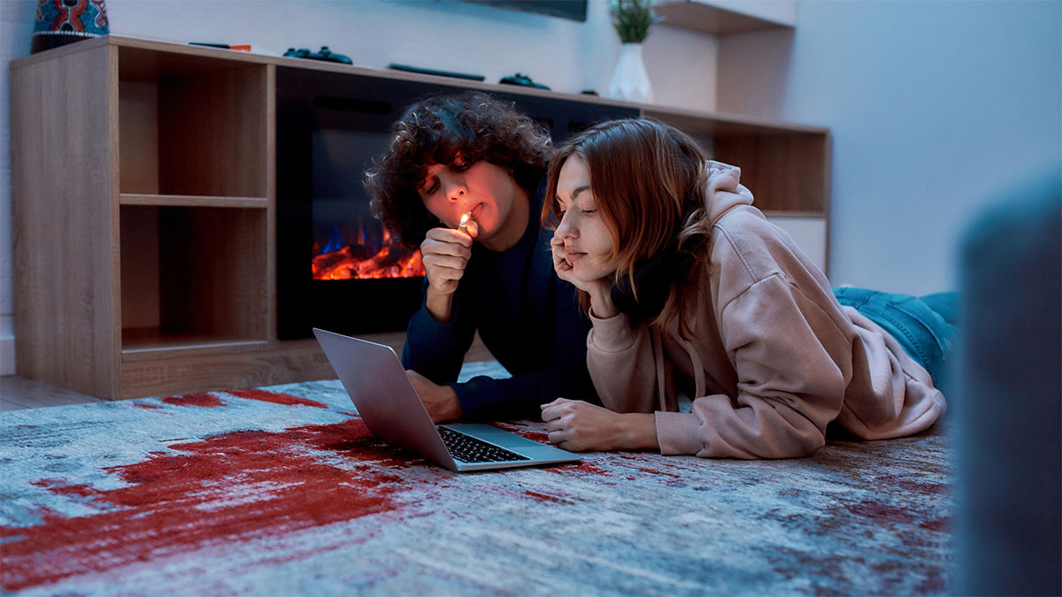 Couple watching movie while smoking weed