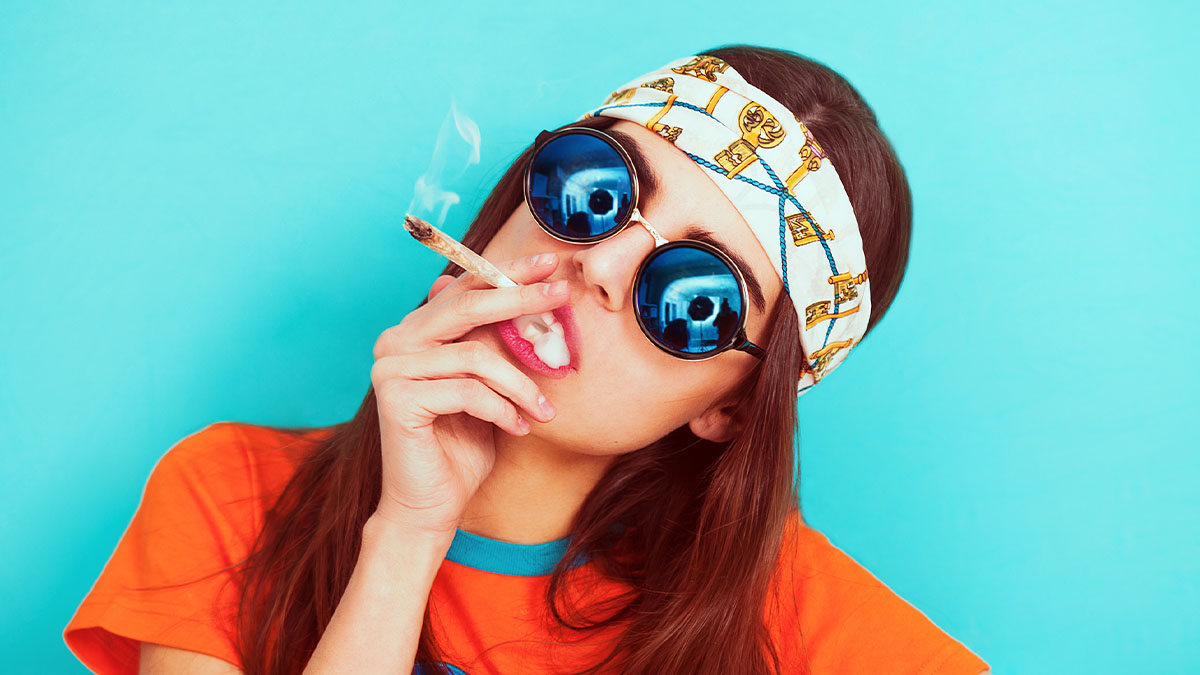 Girl enjoying smoking weed in light blue background