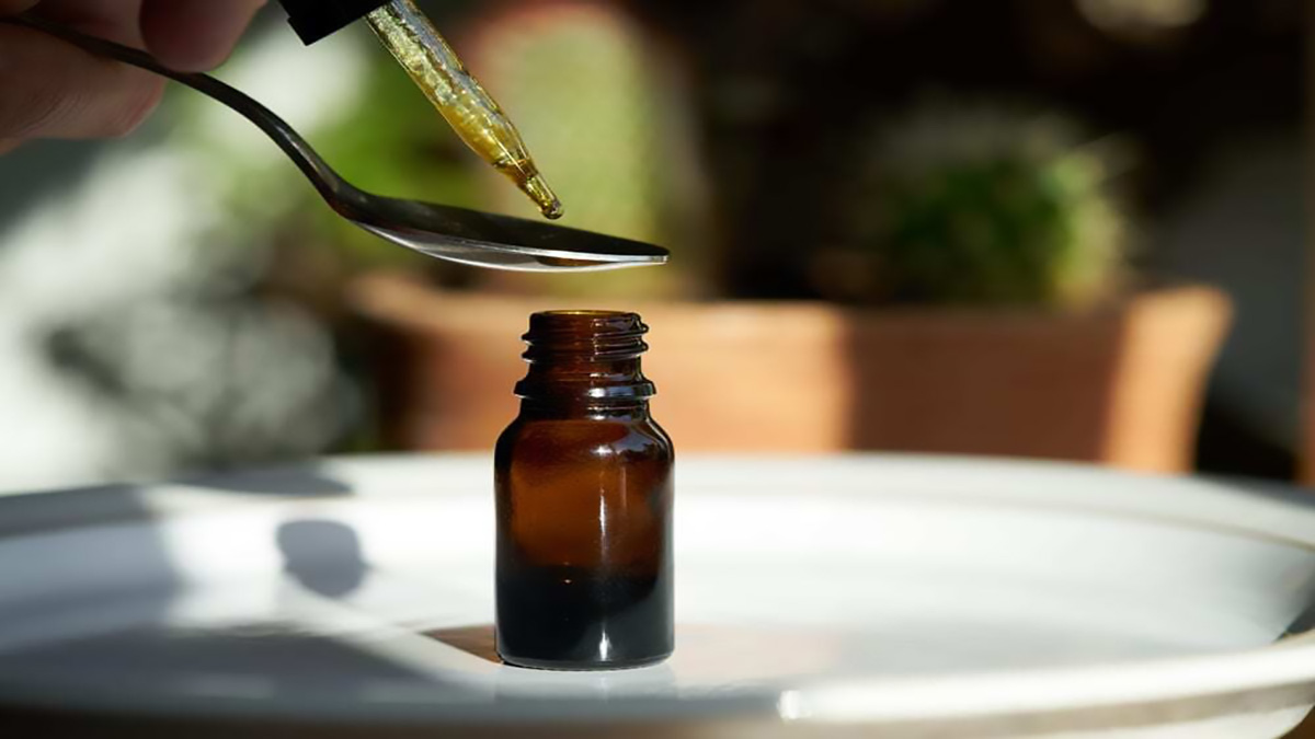 Image of Hemp Oil and Tincture with Spoon and Bottle